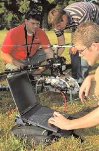 Students with computer controlled helicopter