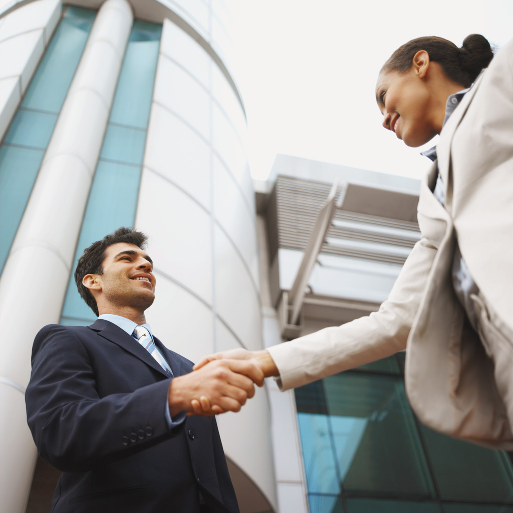 Man and woman shaking hands