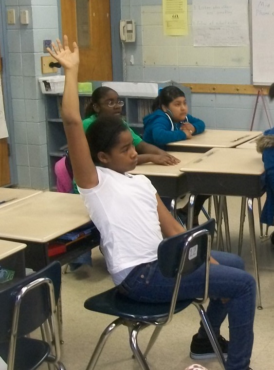 Middle School Girl Raising Hand