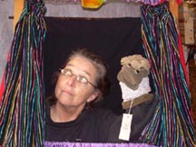 Puppeteer Anne Sue Courtney performs with her puppet.