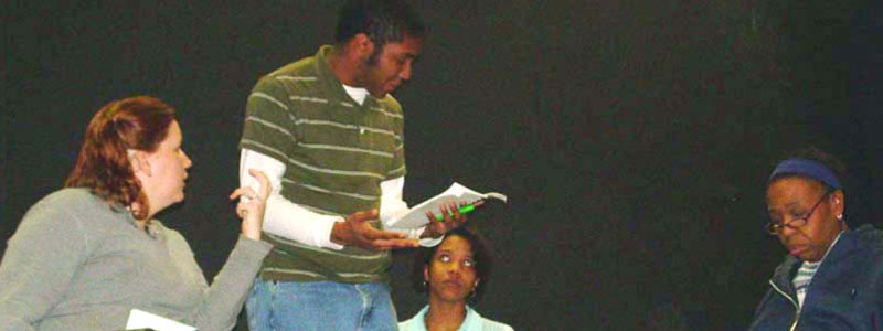 Students practicing reading a script with feeling.