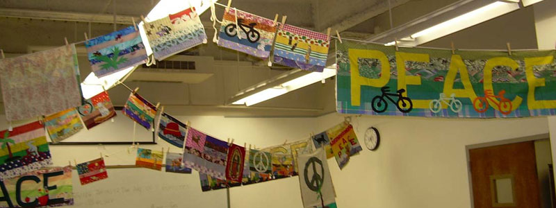 Peace Artwork hung from clotheslines