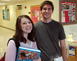 Two undergrad students smiling.