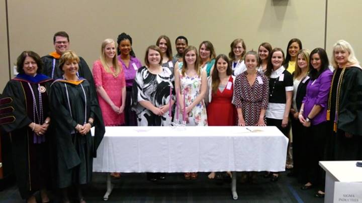Dr. Ann Bianchi, Mr. Mark Reynolds, Dr. Lenora Smith, and Dean Marsha Adams with the Sigma Theta Tau inductees.