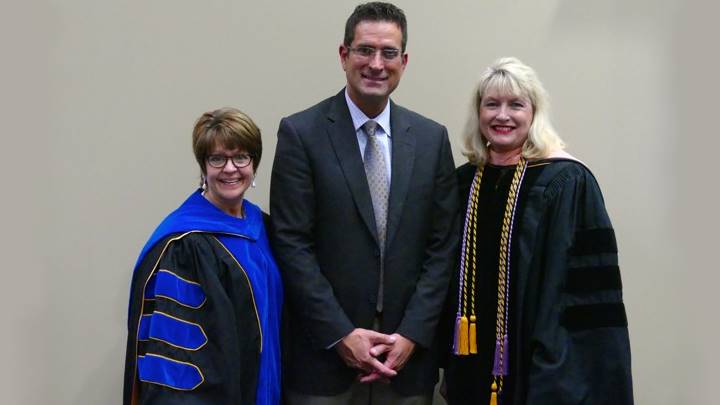 Eddie Damron, recipient of the Research Horizons Undergraduate College of Nursing Award, stands with his research mentor, Dr. Pam O'Neal and Dean Marsha Adams.