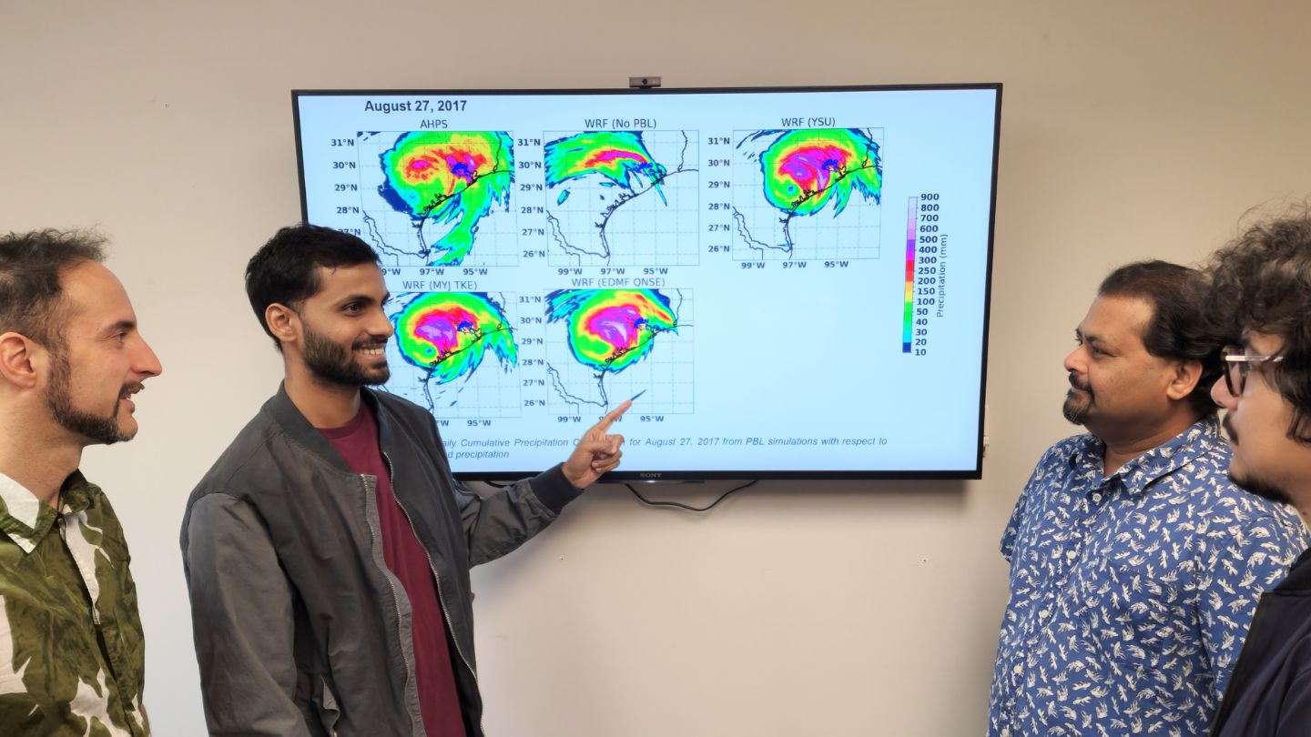 (L-R) Georgios Priftis, Ankur Kumar, Dr. Udaysankar Nair, and Dr. Sujit Roy discussing the precipitation patterns from the hurricane Harvey (2017)  