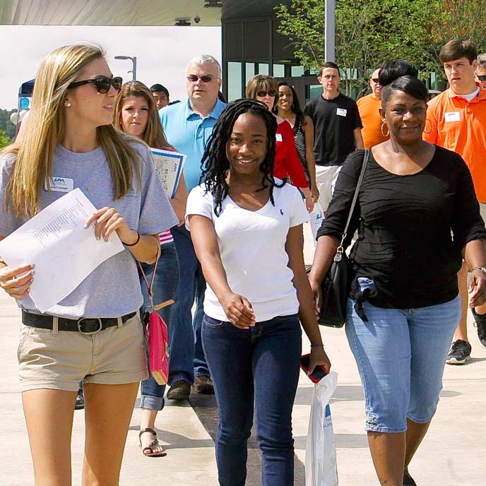 Prospective students and their families tour campus
