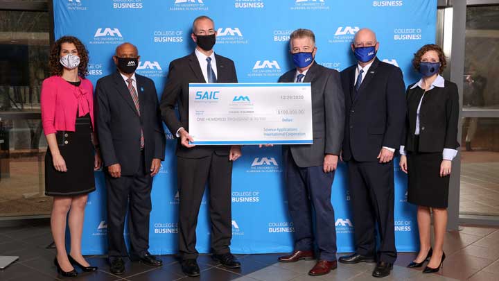 SAIC presents The University of Alabama Huntsville (UAH) with a $100,000 donation ?>