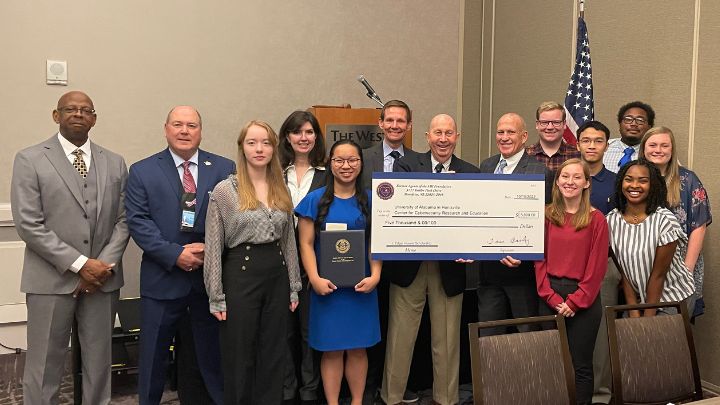 UAH President Charles L. Karr celebrates with CCRE Director Tommy Morris and scholarship recipients. ?>