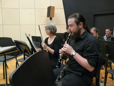 UAH graduates Amy Helser (flute) and Michael Wood (E-flat clarinet) warming up before dress rehearsal.