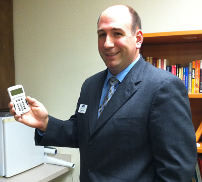 Assistant Dean of Students T.J. Brecciaroli holds one of the clickers being used in this semester’s Charger Success 101 class.