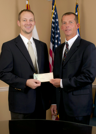 TVA Valley Relations Manager Jason Harper, left, provides a $5,000 grant to UAH's Electrical and Computer Engineering Department. Dennis Hite accepts the grant on behalf of the university.