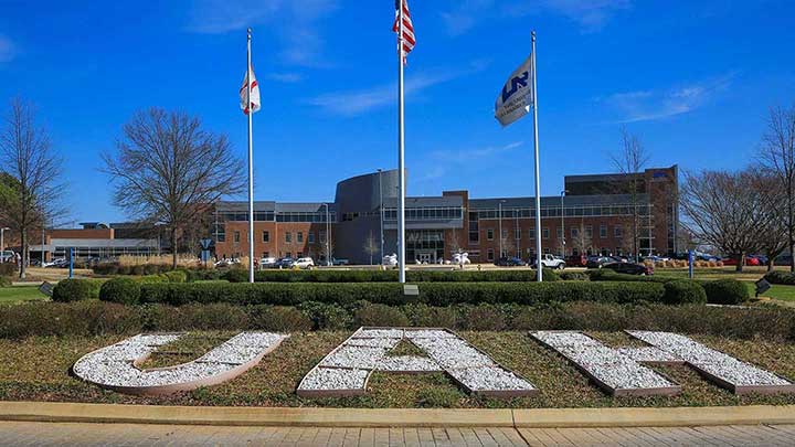 UAH campus with UAH letters painted on grass.