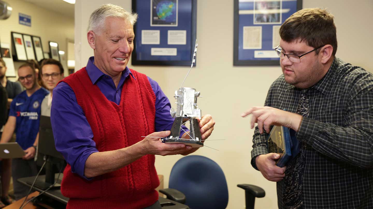 Blake Parker presenting the Parker Space Probe model to Dr. Gary Zank