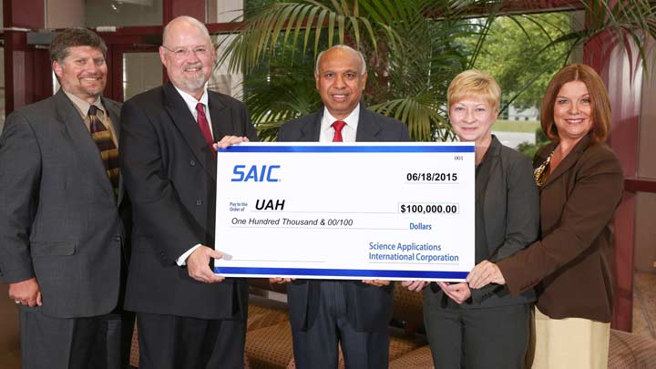 SAIC presents check to UAH College of Business Administration