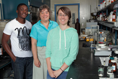 UAH Chemistry professor Dr. Carmen Scholz with doctoral candidate Samuel Nkrumah-Agyeefi and junior Brittany Black in a lab at the Materials Science Building.