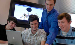 Students looking at computer