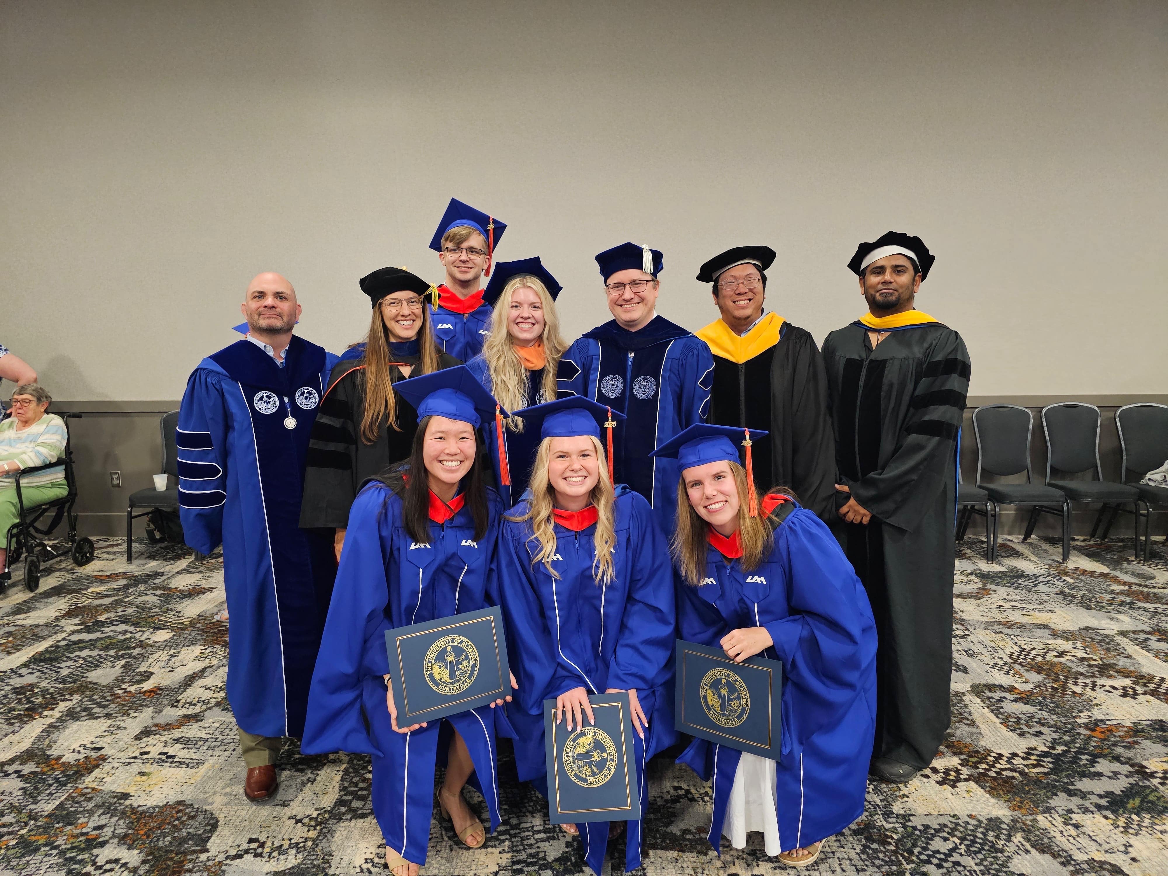 Commencement 2025 some faculty with students
