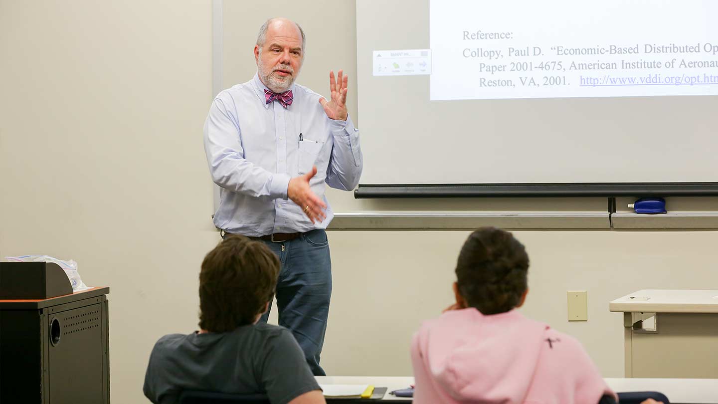 a professor gives a lecture