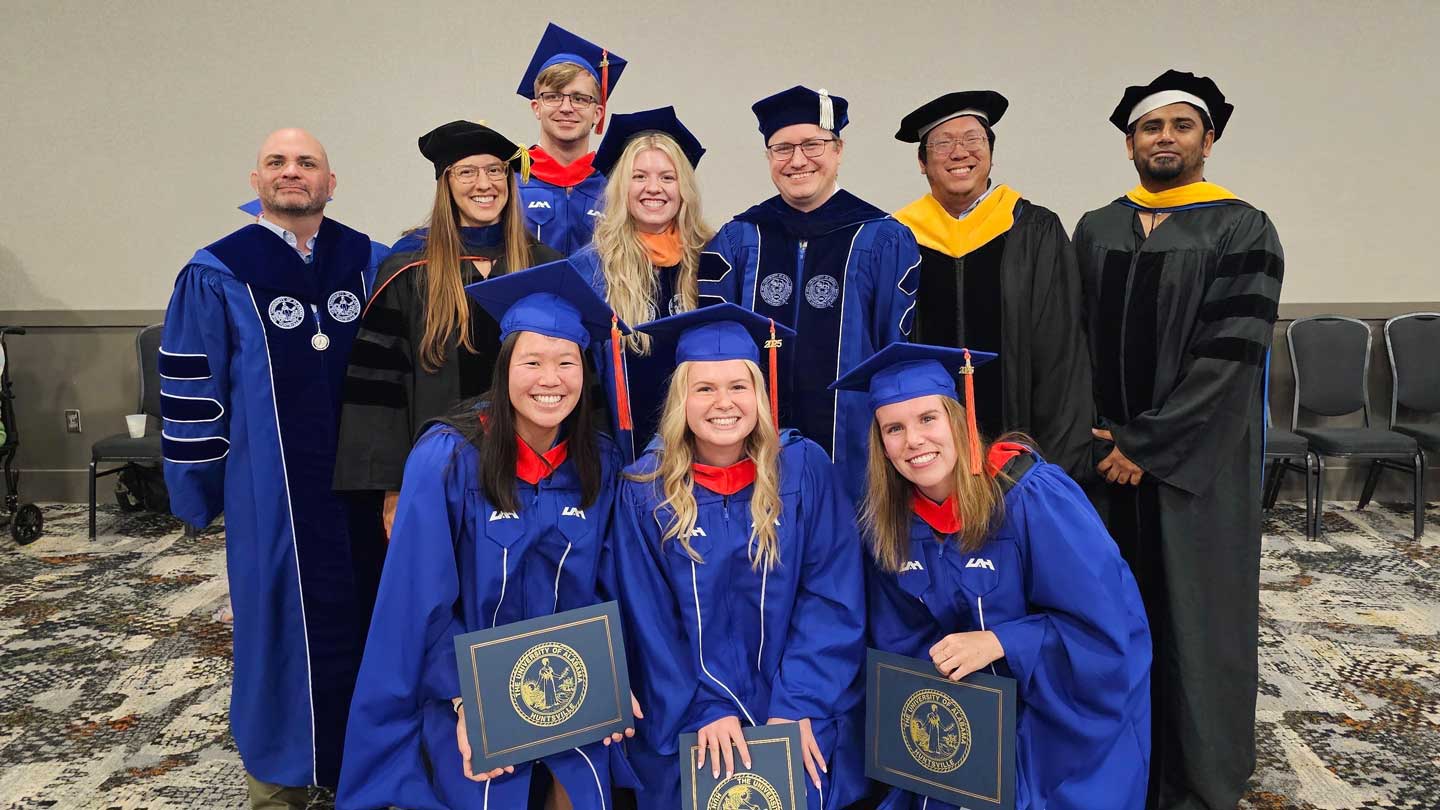 Commencement 2025 some faculty with students