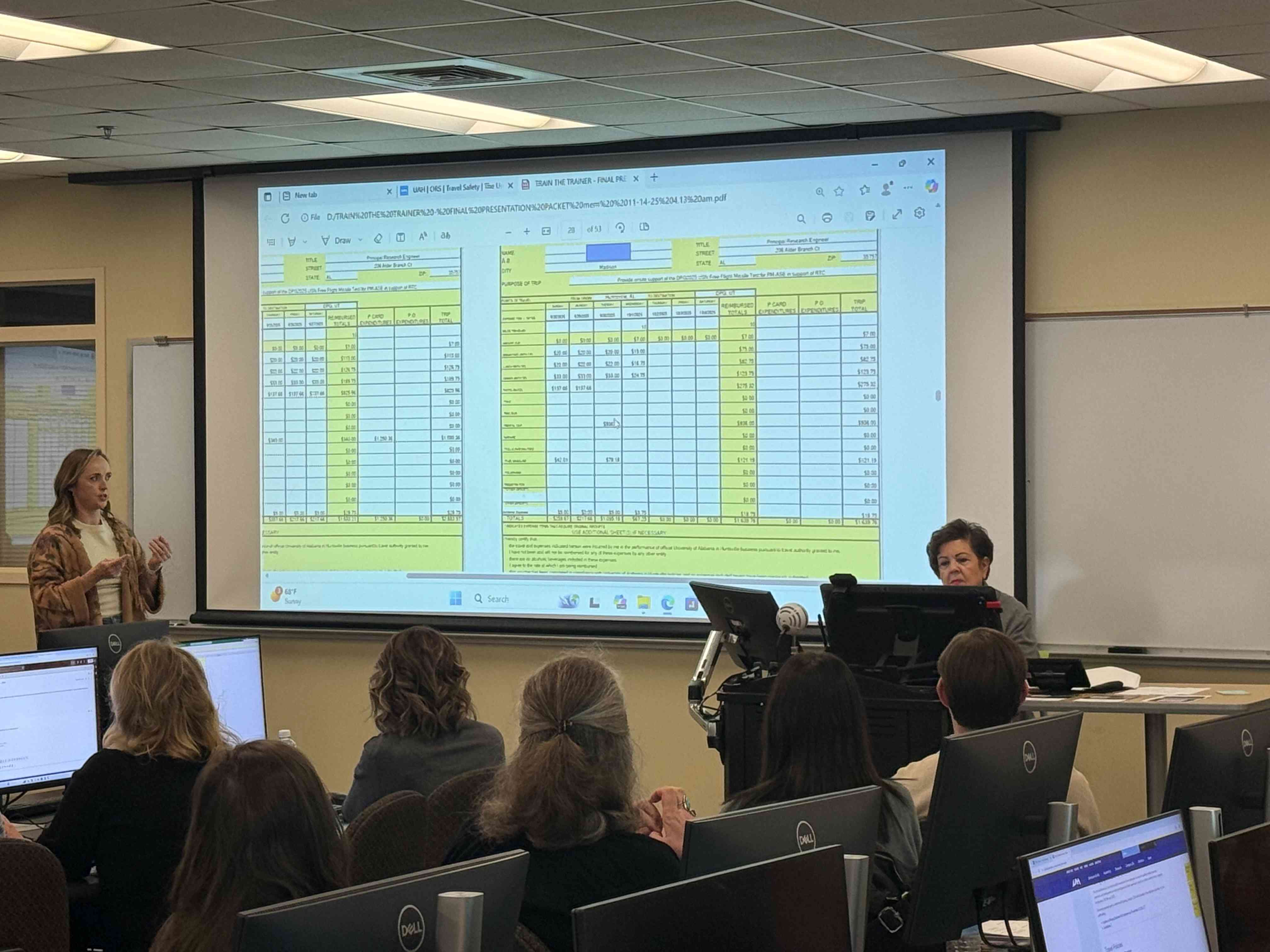 Train the Trainer Travel Liaison Katie Bryant, SMAP, presents to a room of UAH employees
