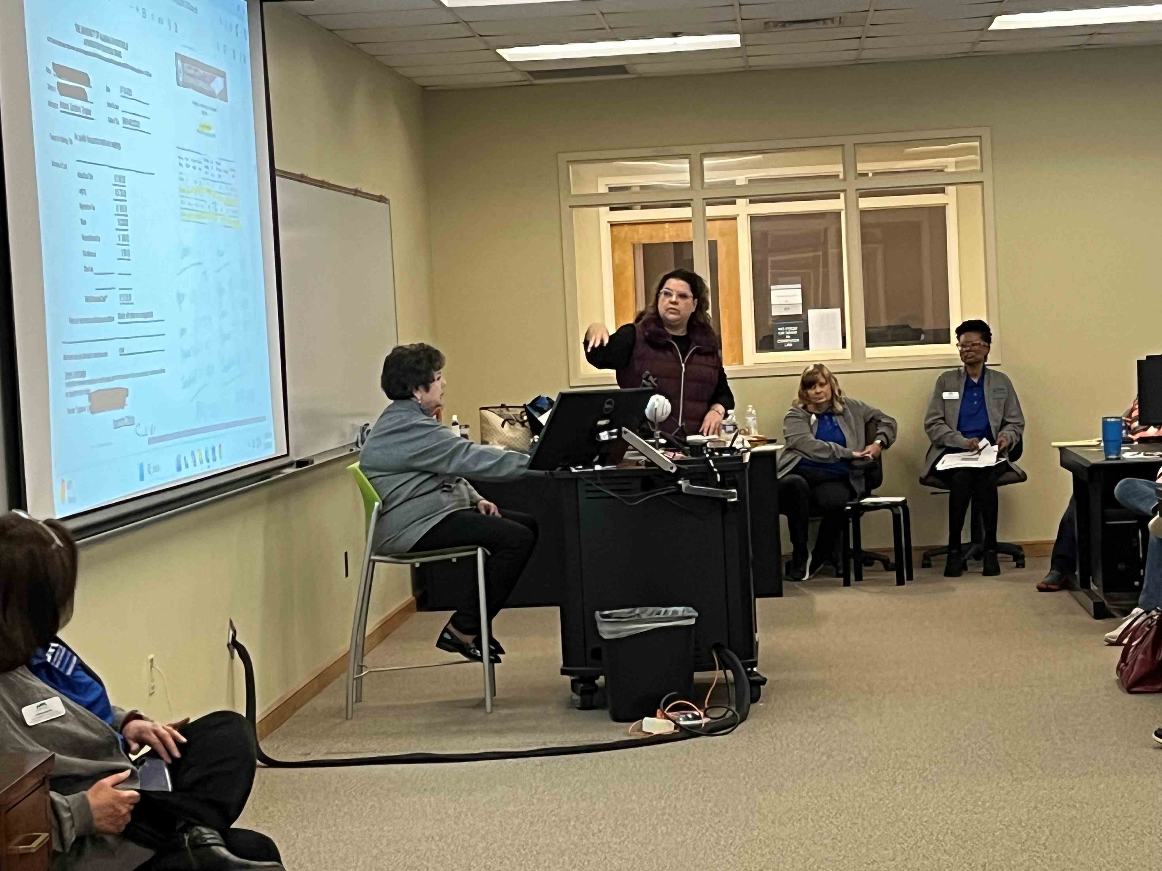 Train the Trainer Travel Liaison Lori Wheeler, Earth System Science Center, presents to a room of UAH employees