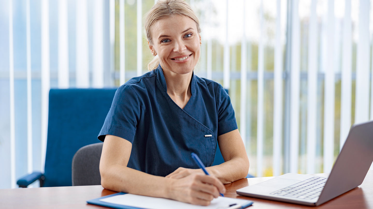 smiling doctor therapist working laptop during app 2023 11 27 05 20 43 utc