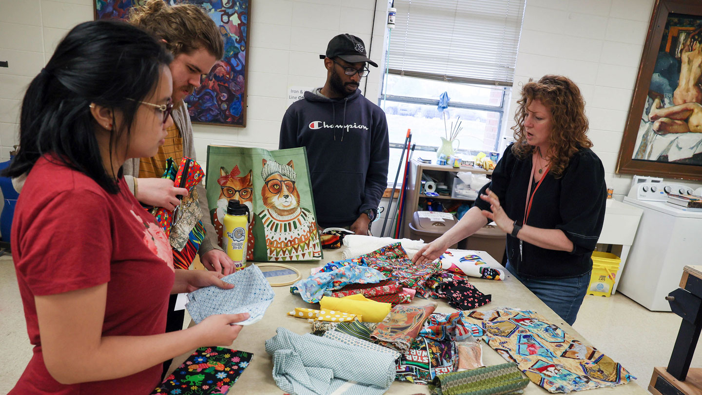 Students work with fabrics for costume design