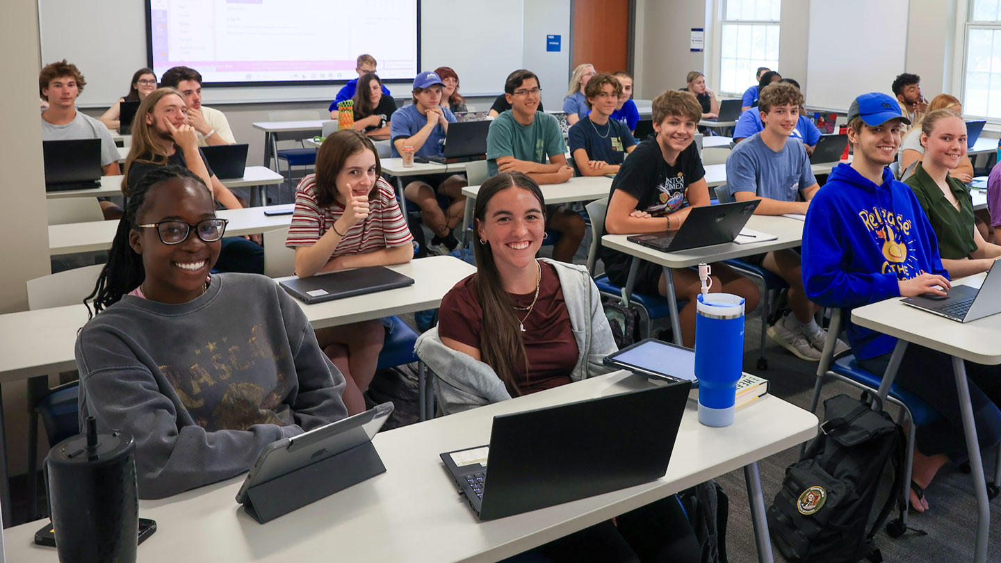 A full classroom enjoys a discussion together