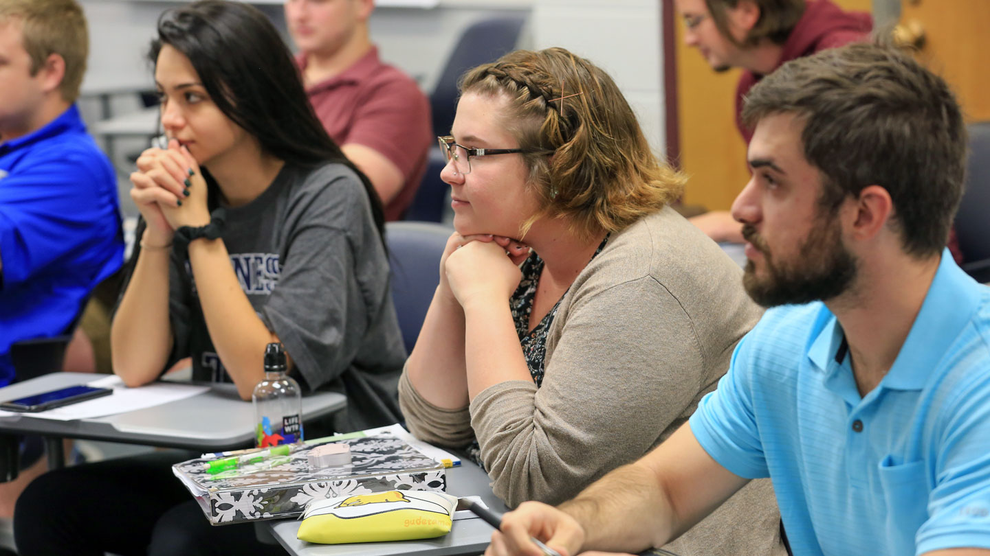 Students listen intently to a lecture
