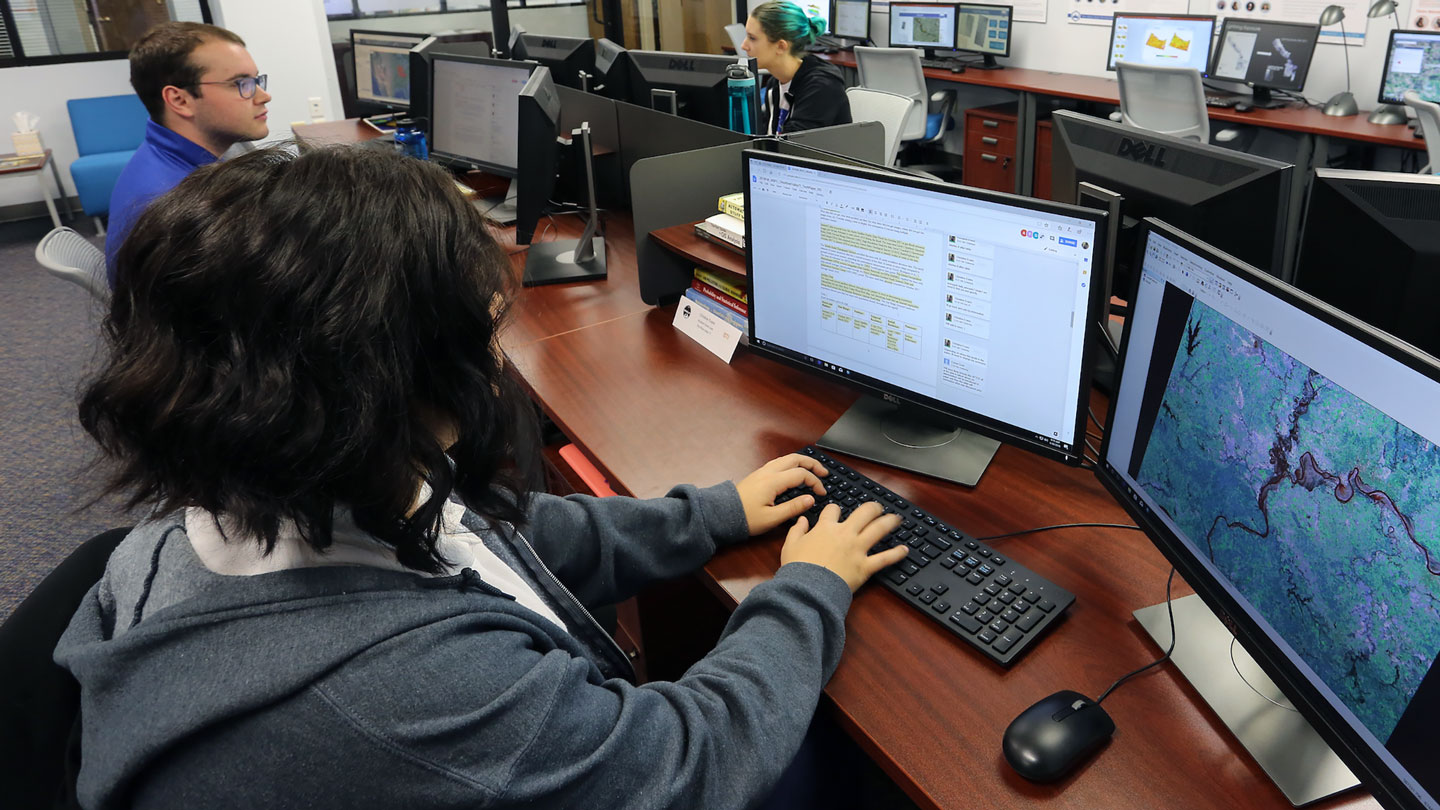 A student uses their computer to complete a lab