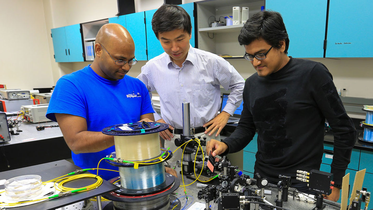 Students conduct a physics experiment merrily