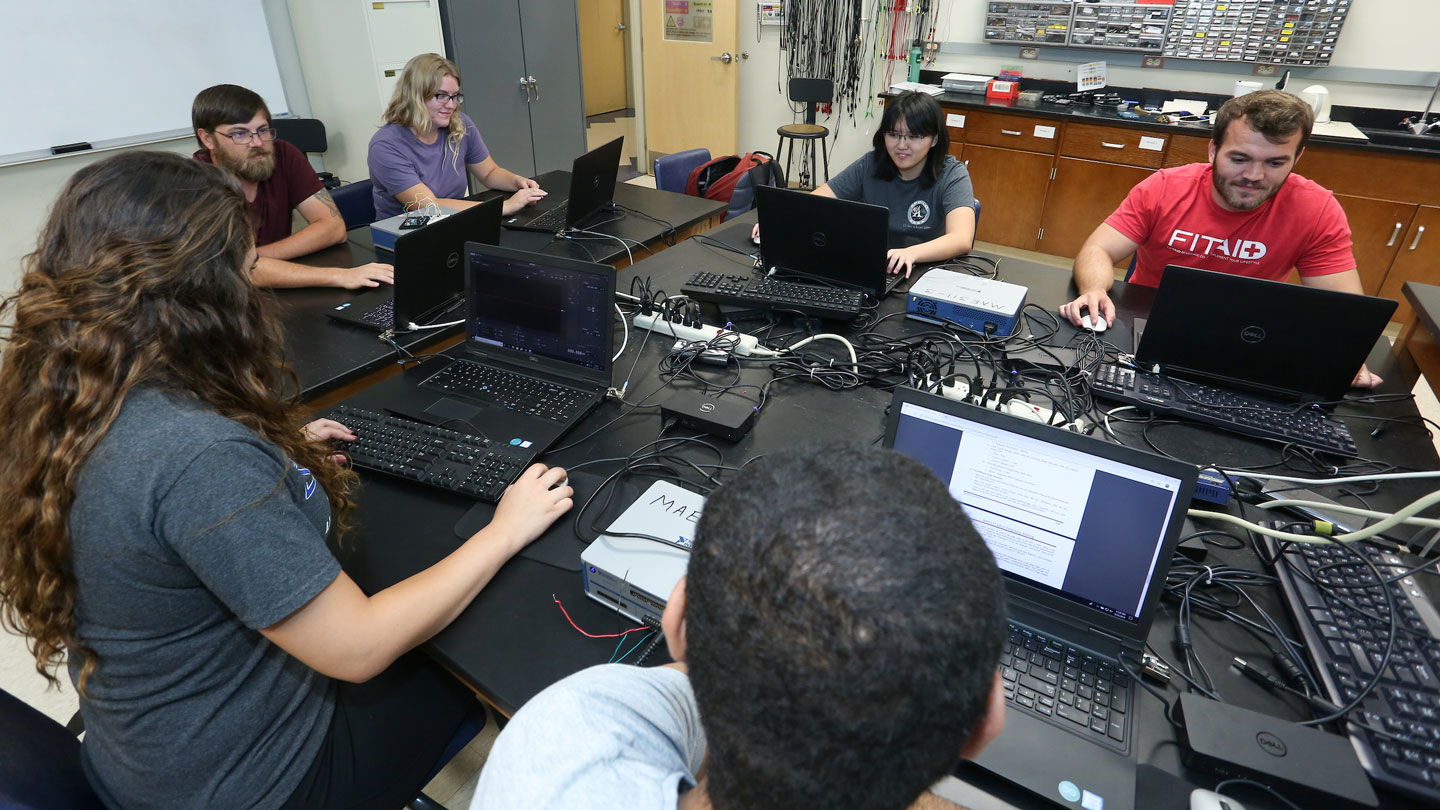 Students use their laptops in a lab