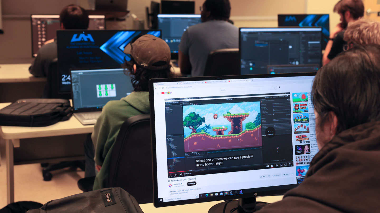 A student watches a video on game design