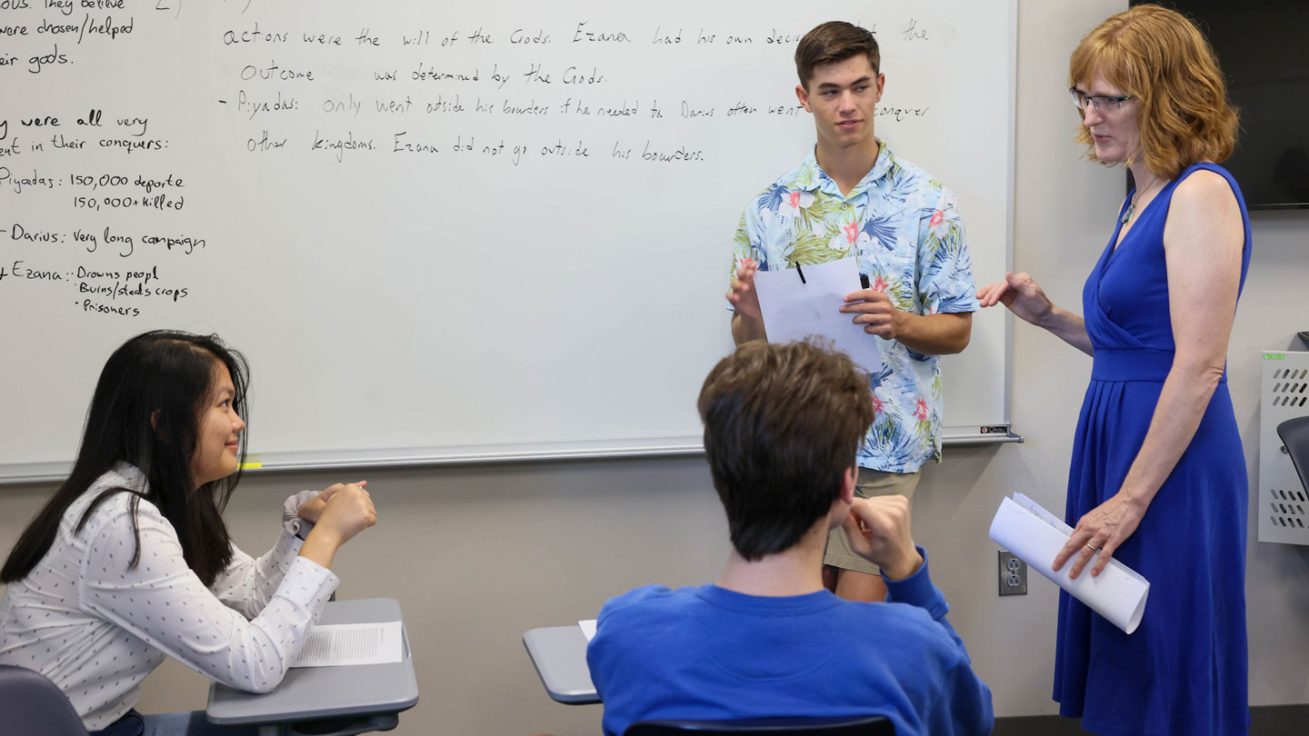 Students in a group engage in conversation