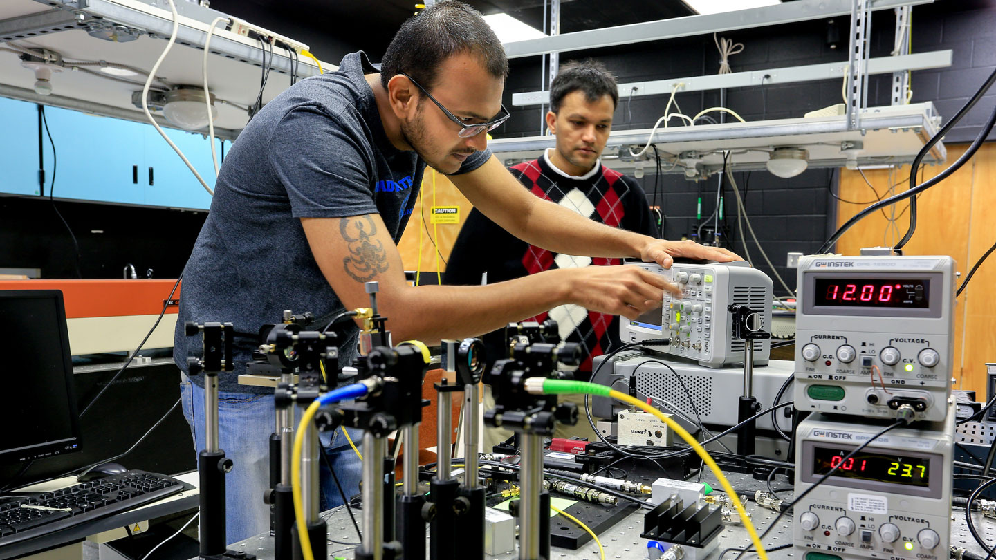 Students work on electronic equipment