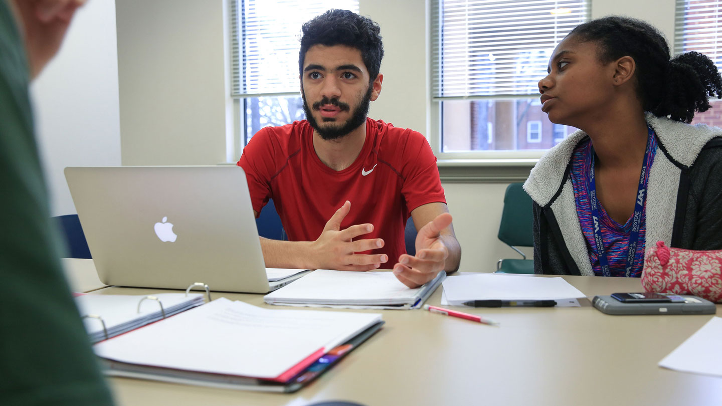 A student leads the discussion with his group