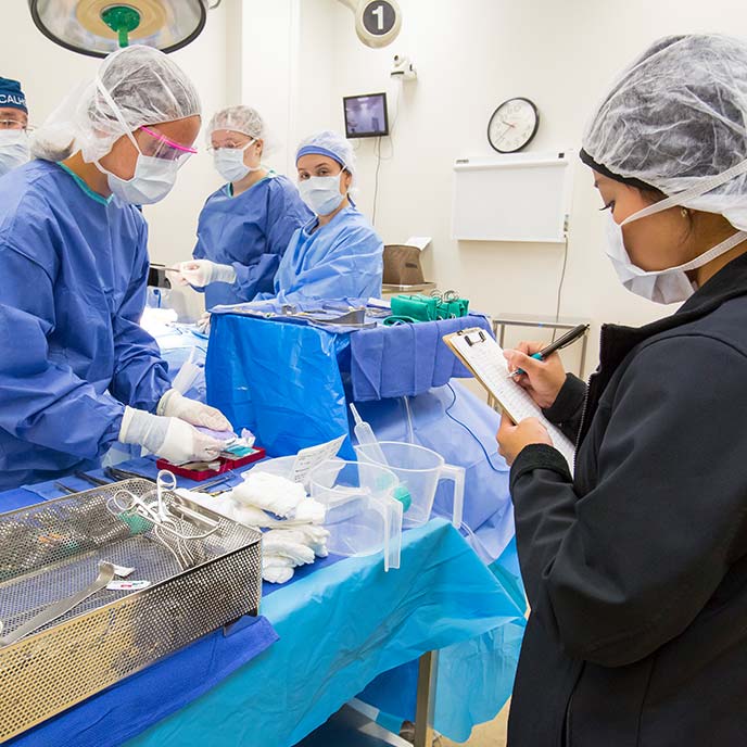 nursing students doing a simulation surgery