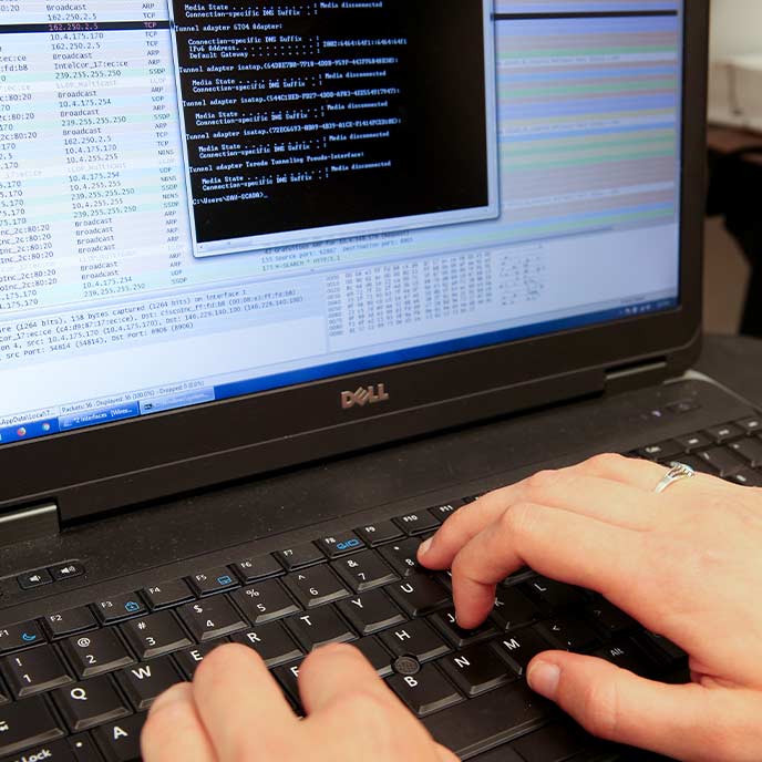 fingers typing on a keyboard