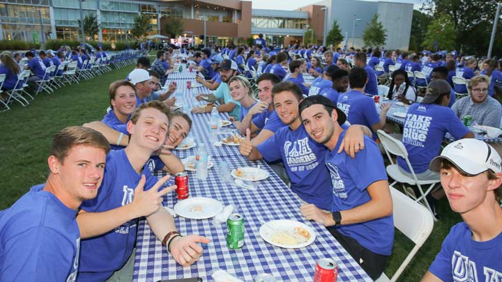 UAH students sitting at picnic tables