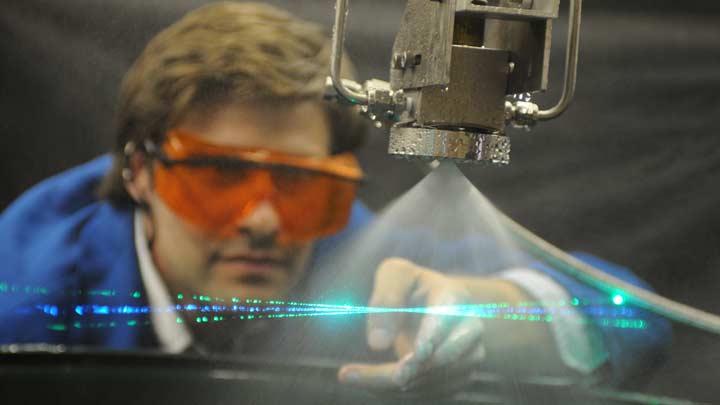 Laser light passing through a water jet