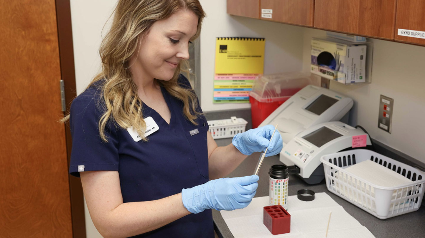 A UAH health services nurse at work in the clinic's medical lab