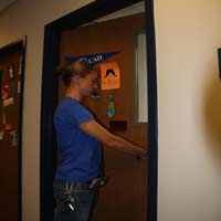 student opening a door