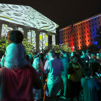 Community members attend a light festival in downtown Huntsville.