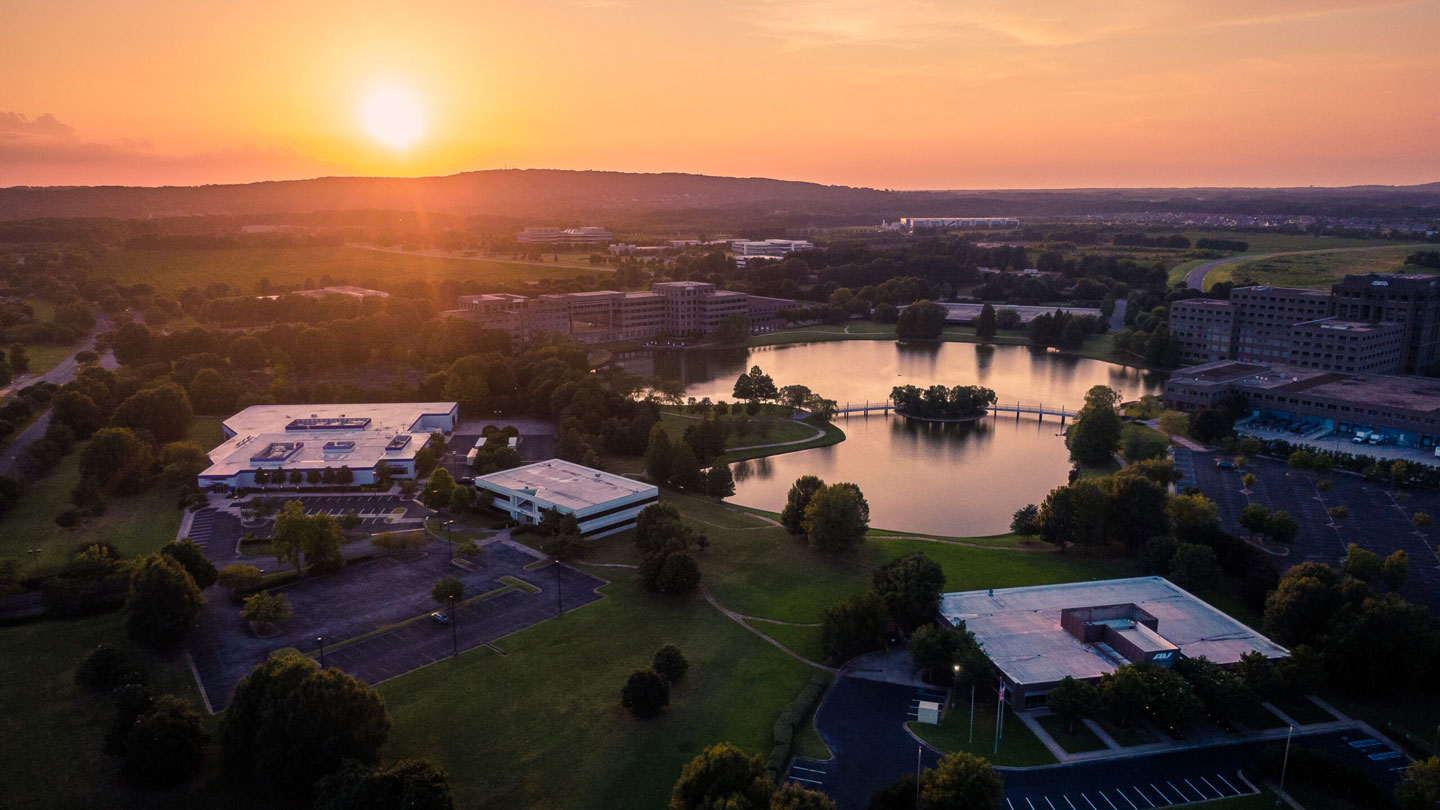 An aerial photograph of the lake in the center of Cummings Research Park at sunset.