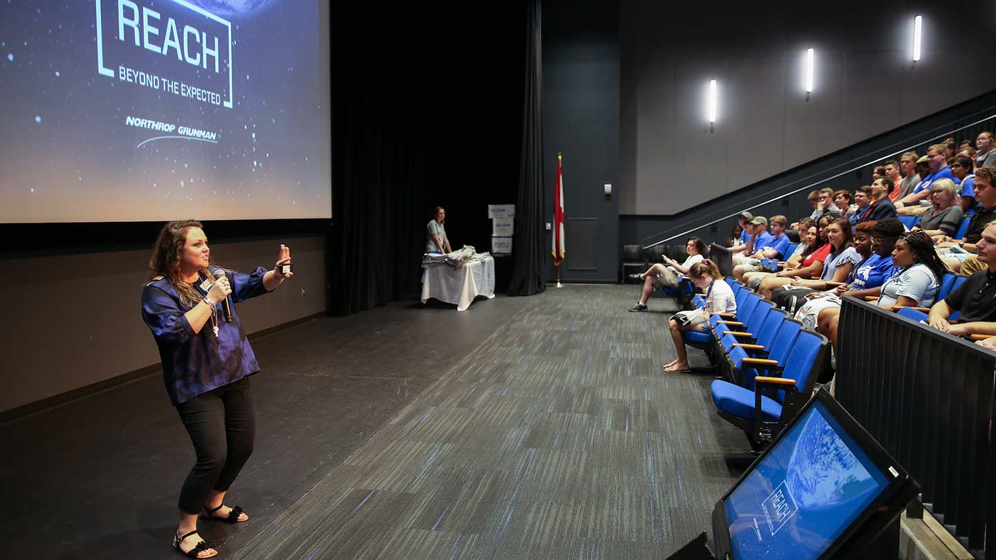 Northrop Grumman giving a presentation to a theatre style seated audiance.