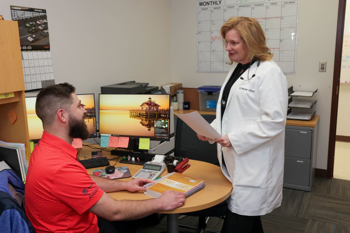 Connie Abbott and Louise O'Keefe posing together at the UAH clinic office.