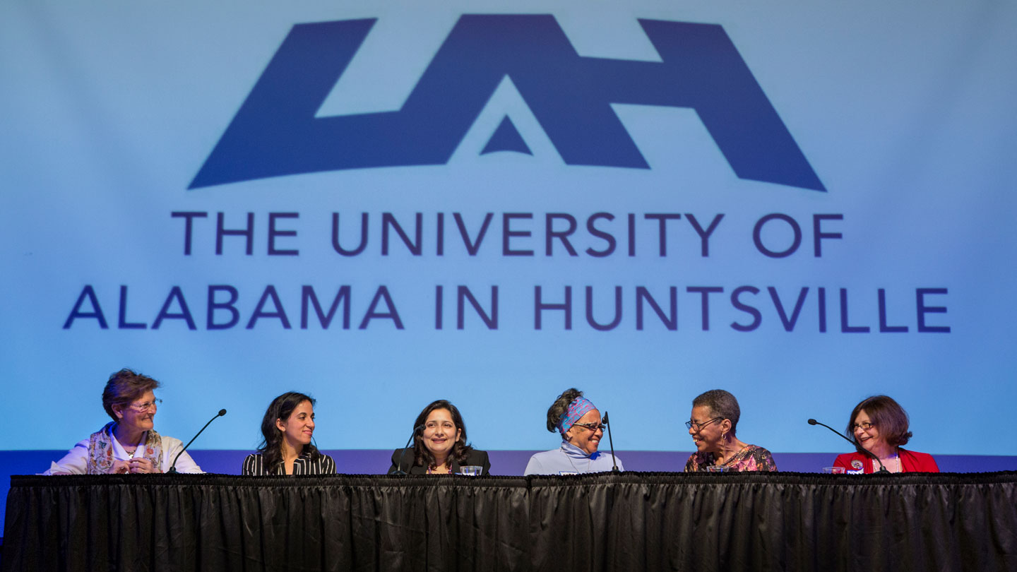 a panel of interfaith woment religious leaders answer questions at a conference at UAH