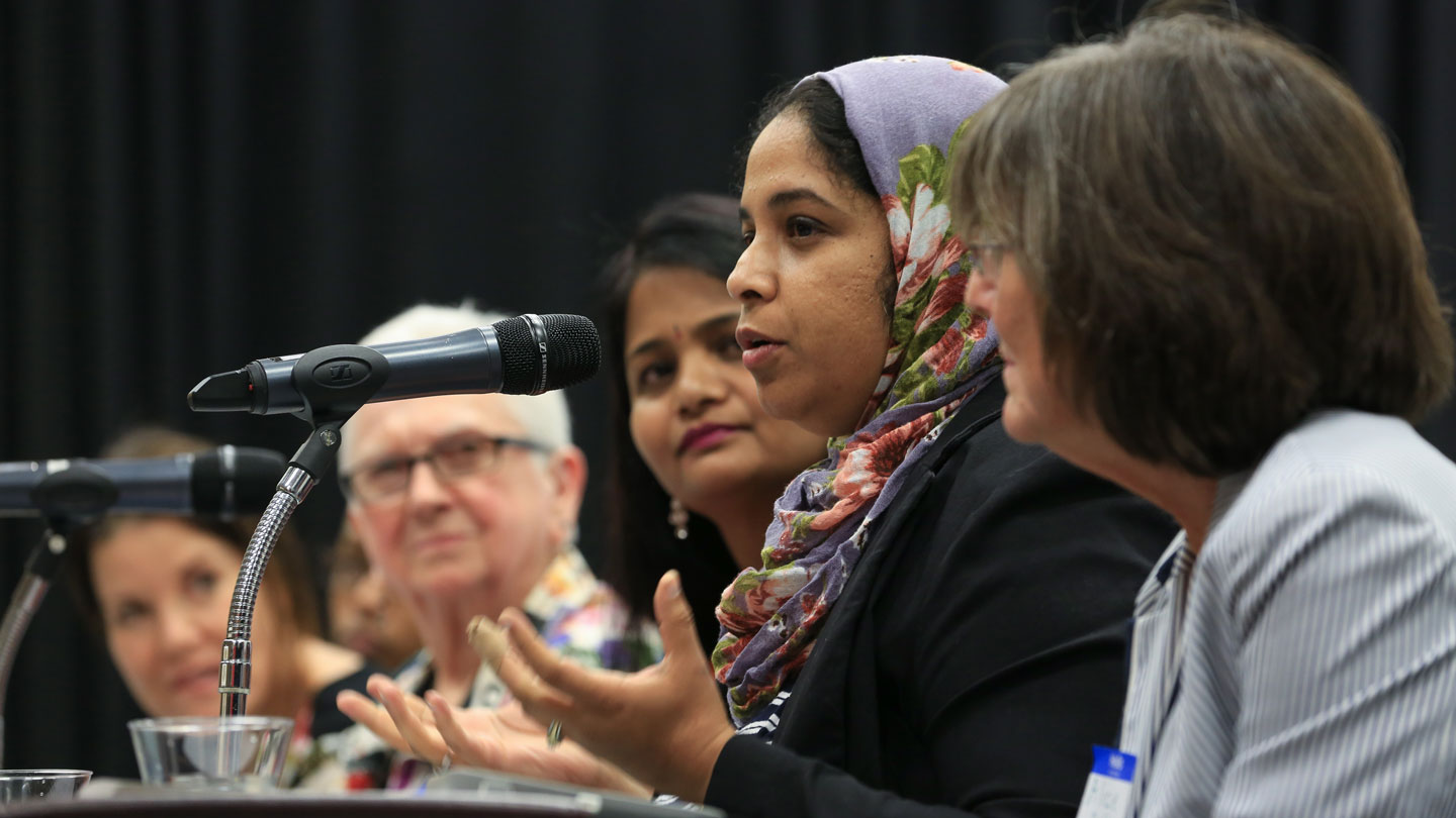 a panel of interfaith women leaders answer questions at a summit at UAH
