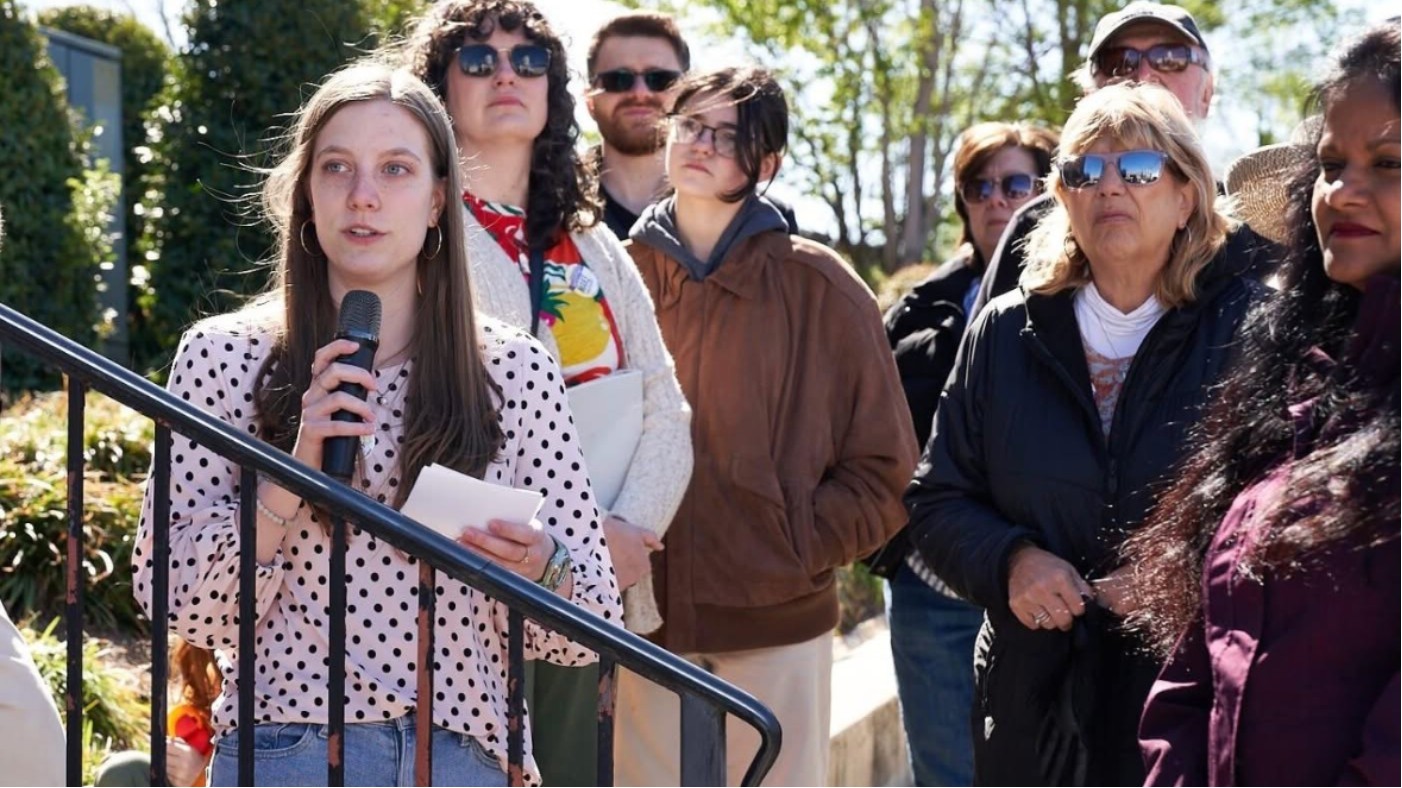Gloria Sipper Giving Speech in Huntsville at Internship in front of Crowd